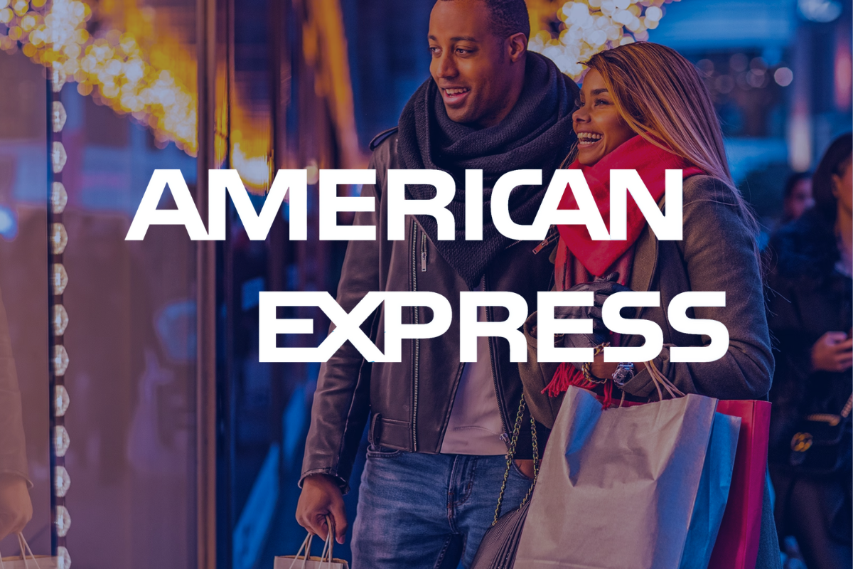 American Express Logo over an image of a couple holiday shopping