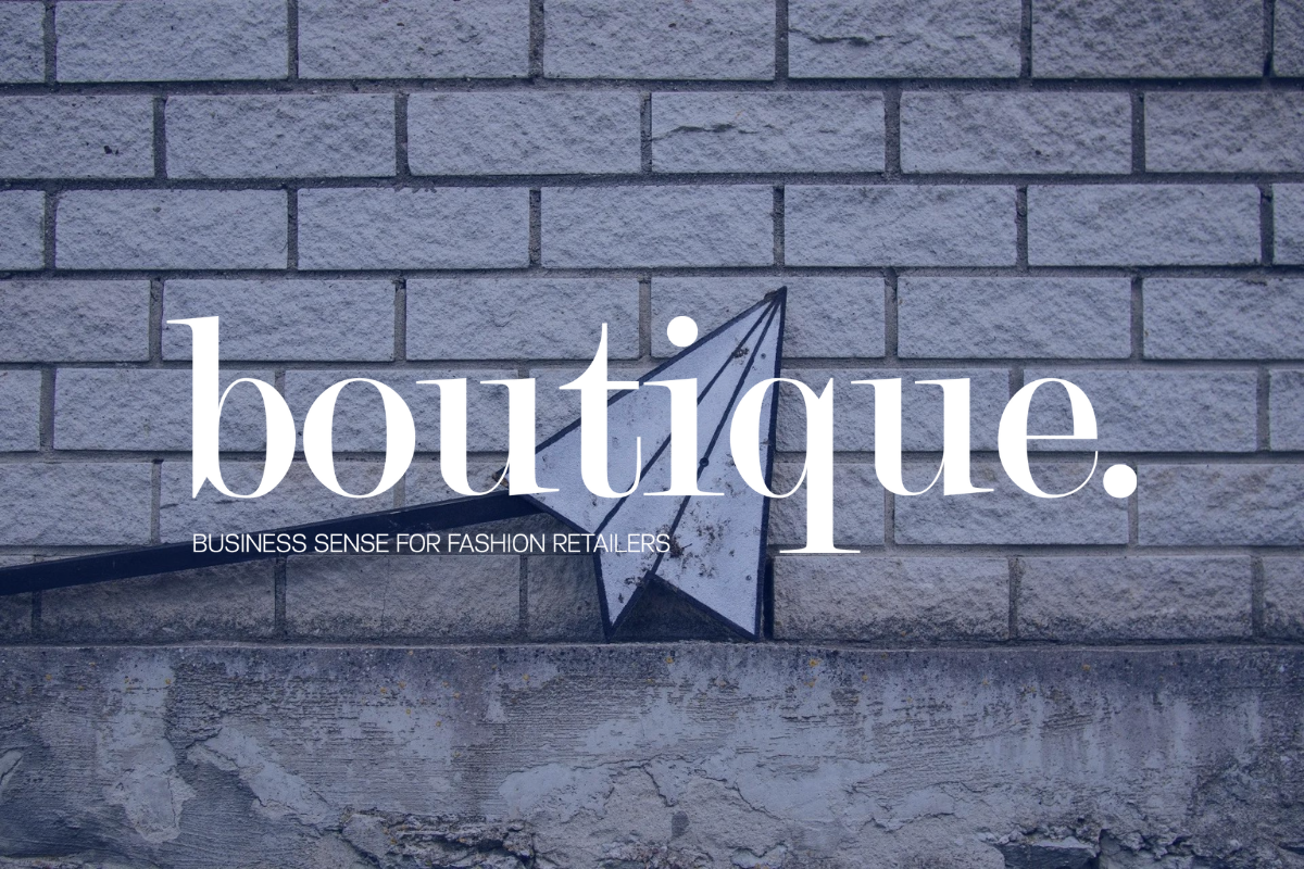 boutique magazine logo over an image of a paper airplane and bricks.